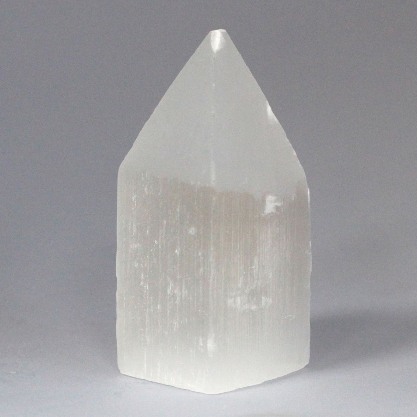 Authentic Selenite Pencil Point Tower - 10 cm showcasing clean geometry and natural material finishes