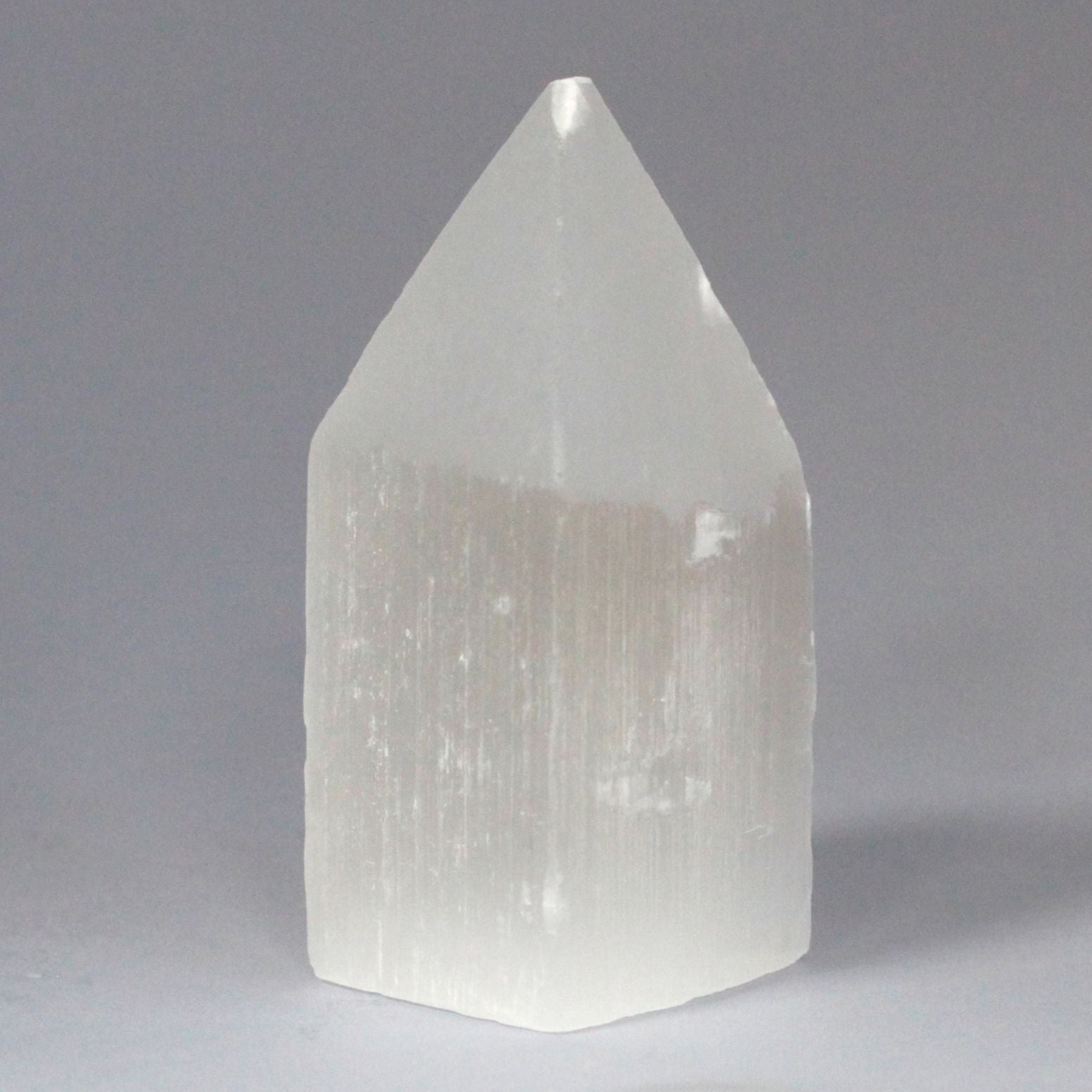 Authentic Selenite Pencil Point Tower - 10 cm showcasing clean geometry and natural material finishes