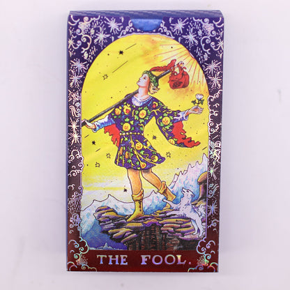Card featuring 'The Fool' from a tarot deck with colorful illustration on a white background